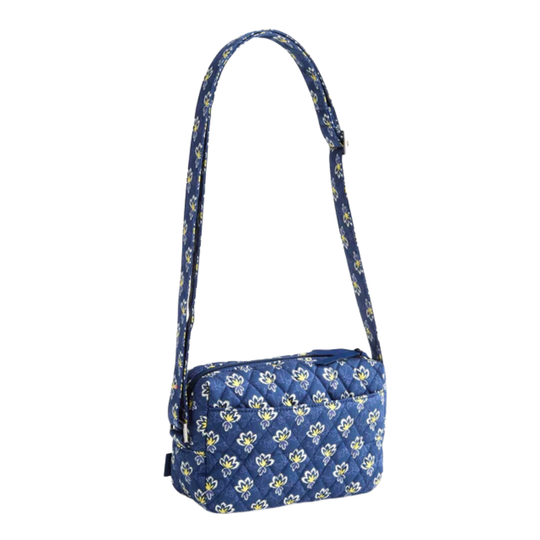 Blue floral patterned shoulder bag on a white background