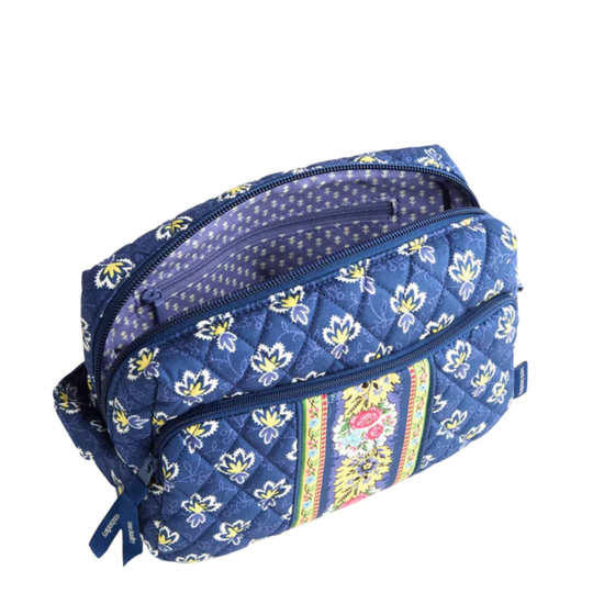 Blue floral-patterned cosmetic bag on a white background
