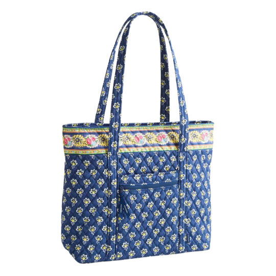 Blue floral patterned tote bag with colorful trim on a white background