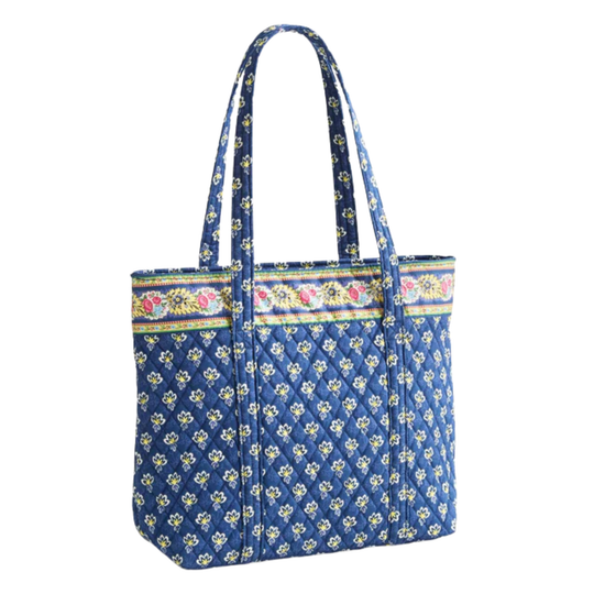 Blue floral patterned tote bag with colorful trim on a white background