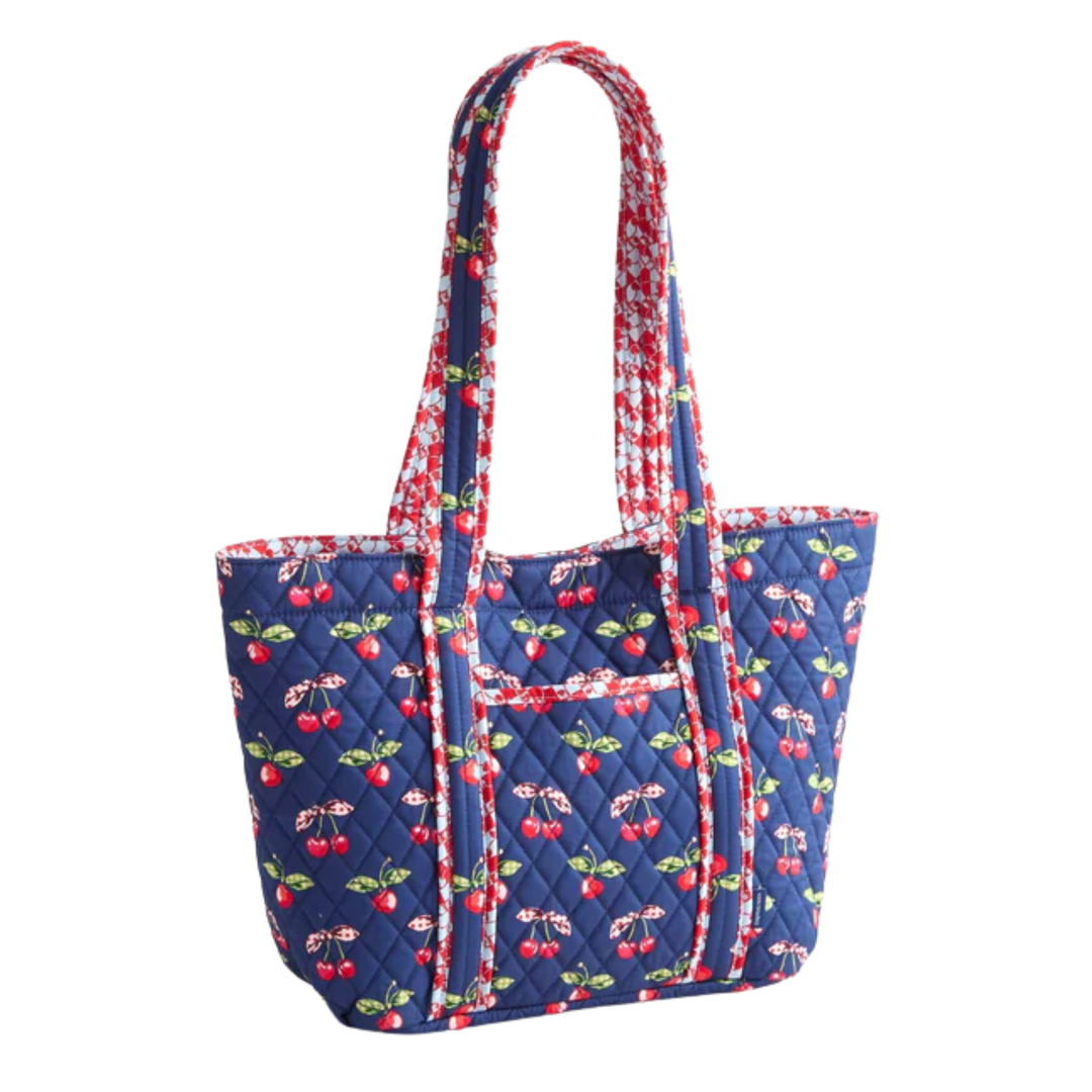 Quilted tote bag with cherry pattern on a white background