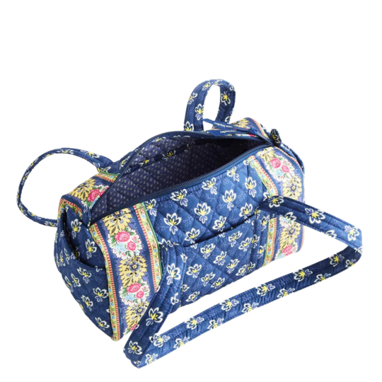 Floral patterned handbag on a white background