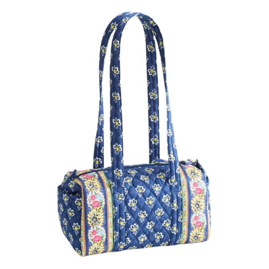 Blue floral patterned handbag on a white background