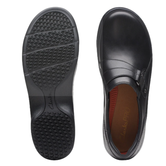 Black shoe with sole showing texture on a white background