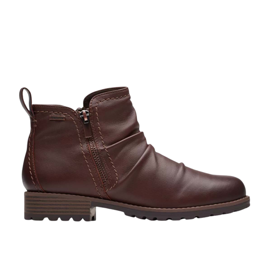 Brown leather ankle boot on a white background