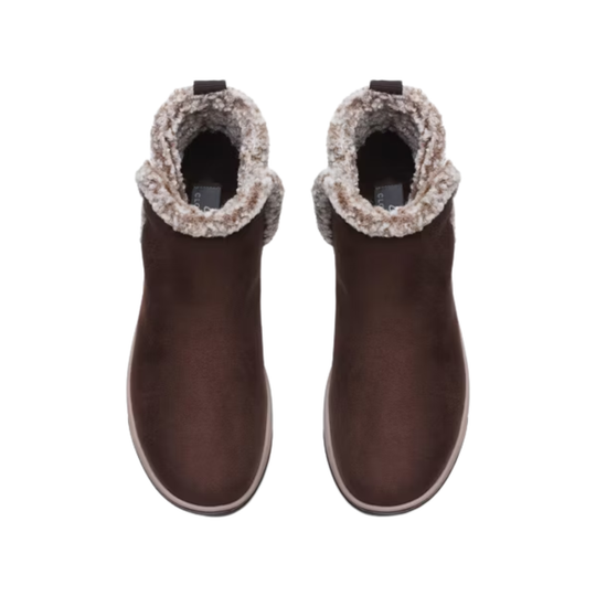 Pair of brown ankle boots with fluffy trim on a white background