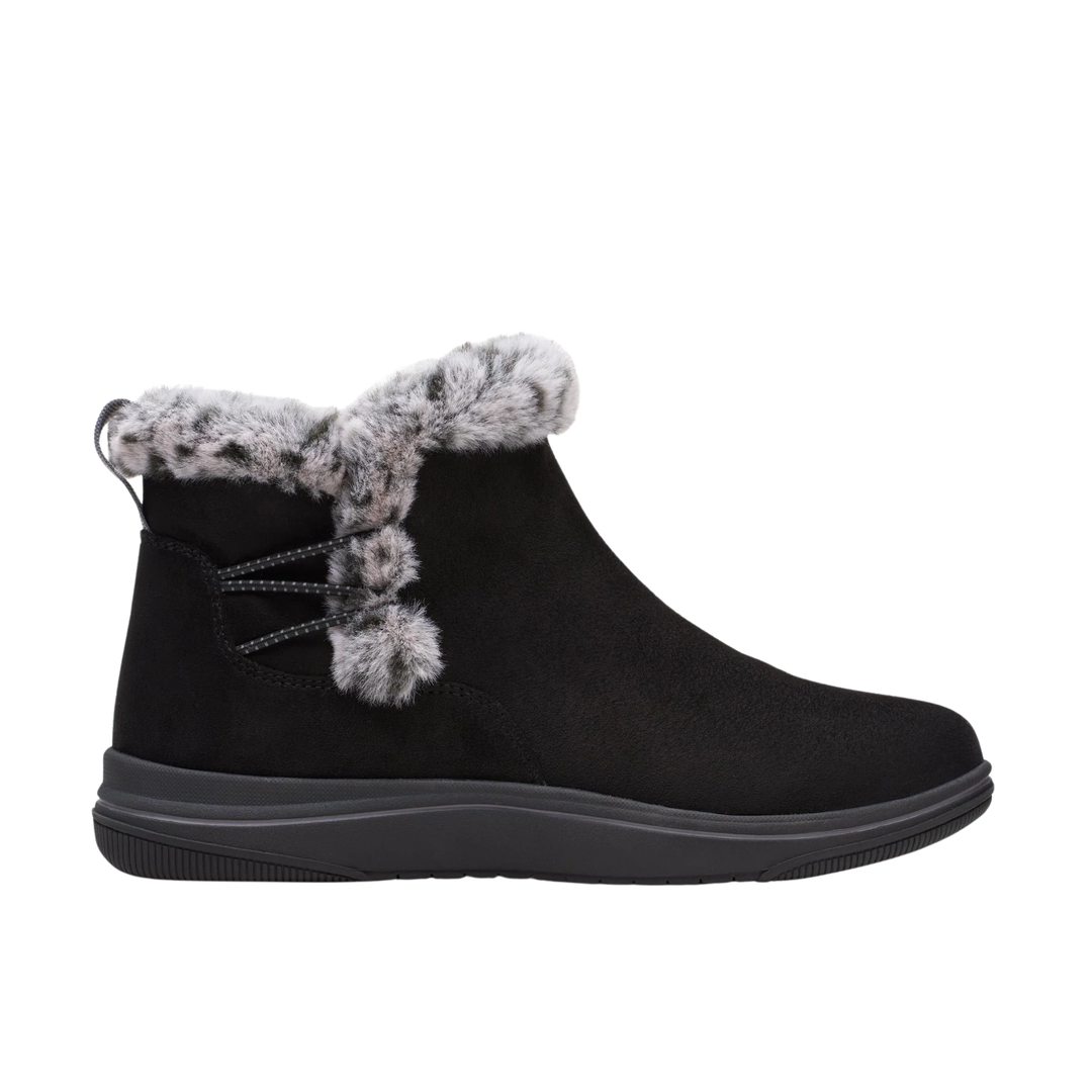 Black ankle boot with fuzzy trim on a white background