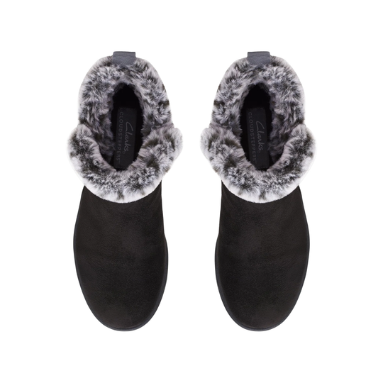 Pair of black ankle boots with gray fur trim on a white background