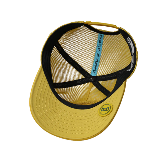 Yellow cap with black mesh and visible branding on a white background
