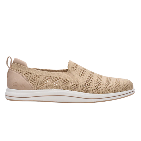 Beige slip-on sneaker with white sole on a white background