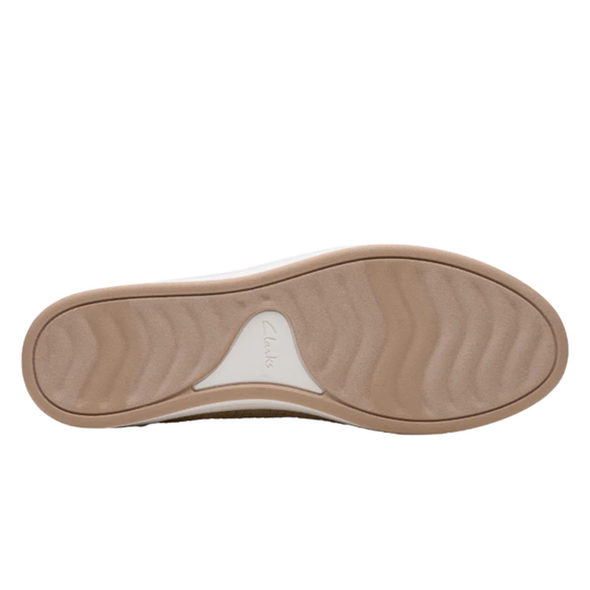Tan shoe sole with a white arch support on a white background