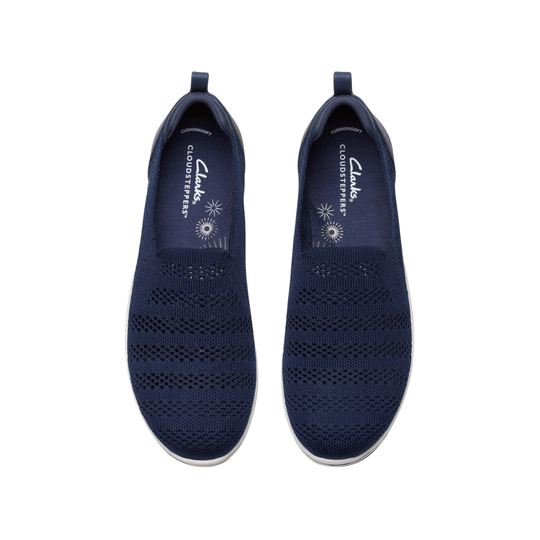 Pair of navy blue slip-on shoes with 'Clarks' branding on a white background