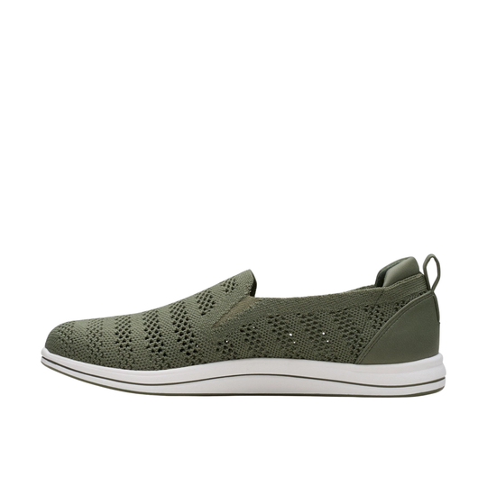 olive sneaker with white sole on a light gray background