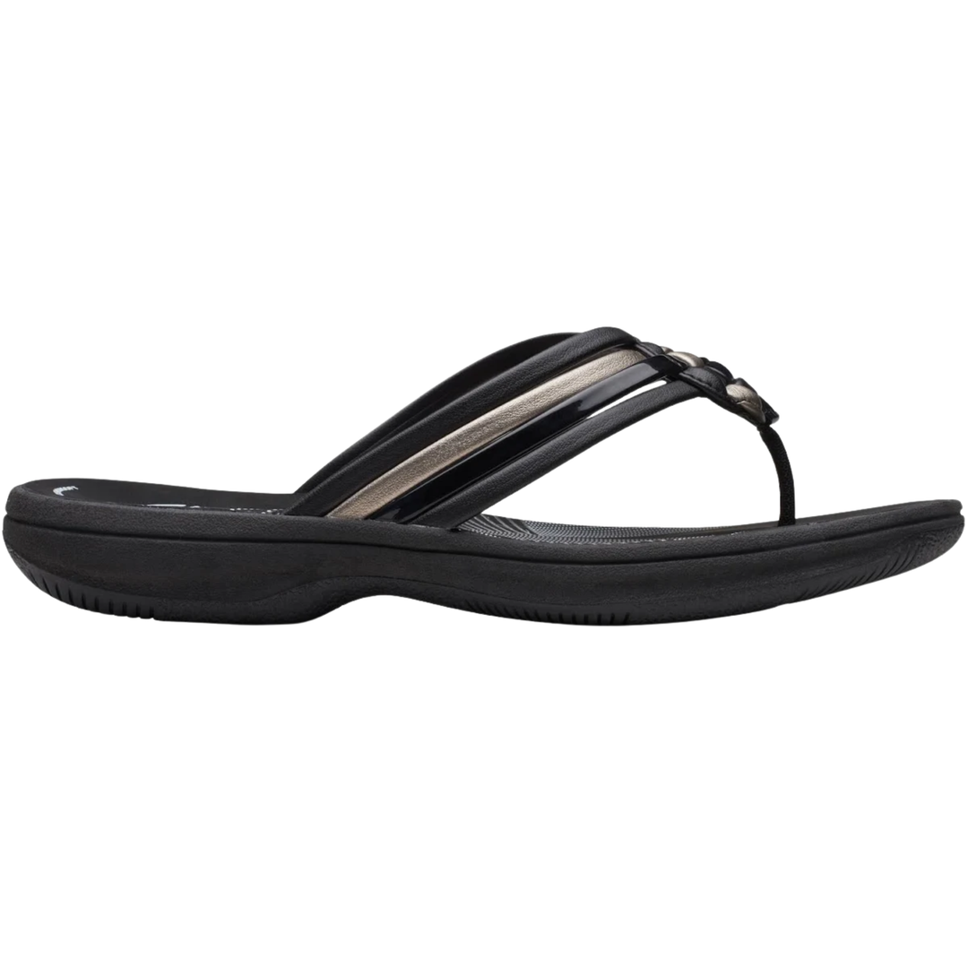 Black sandal with a metallic strap on a white background
