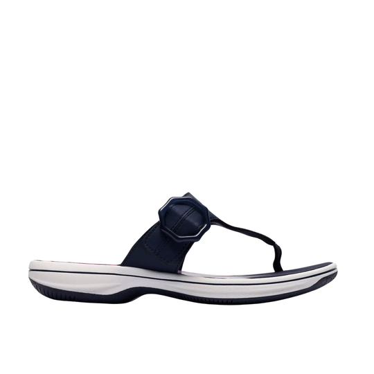 Navy sandal with a white sole on a white background