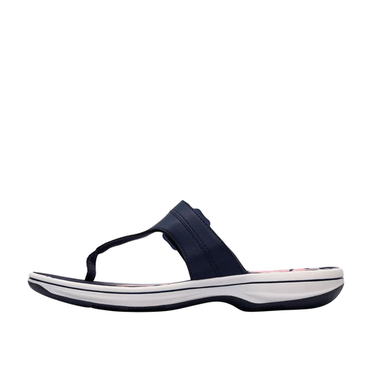 Navy sandal with a white sole on a white background