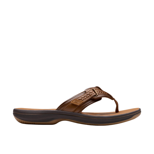 Brown sandal with a strap on a white background