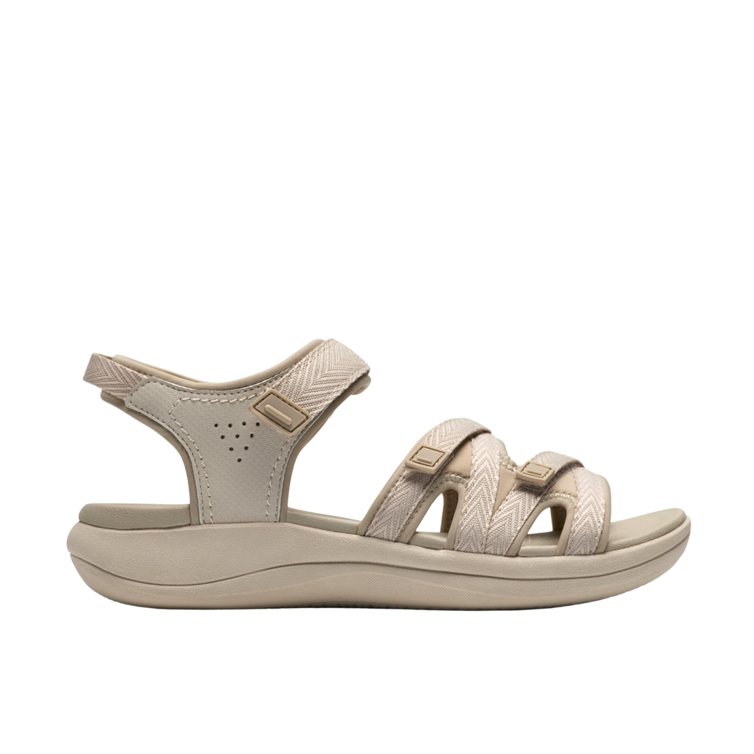 Beige sandal with multiple straps on a white background