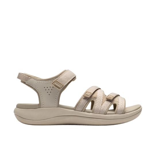 Beige sandal with multiple straps on a white background