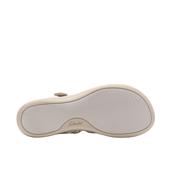 Beige sandal sole with textured tread and Clarks logo on a white background