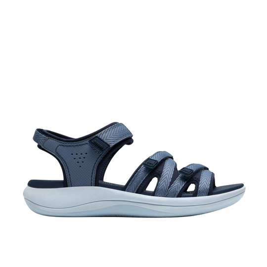 Navy sandal with a white sole on a white background