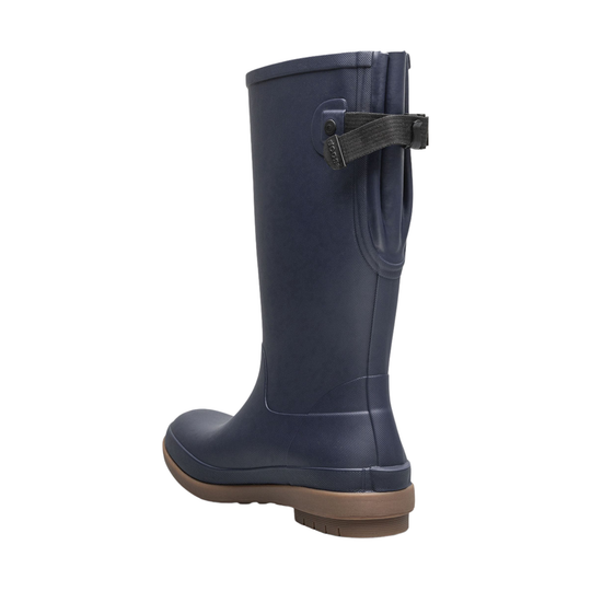 Navy blue rain boot with a brown sole on a white background