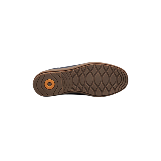 Brown shoe sole with tread pattern on a white background