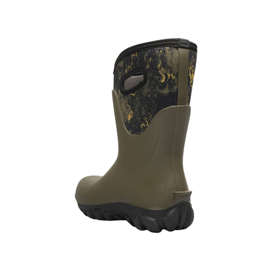 Green rubber boot with black pattern on a white background