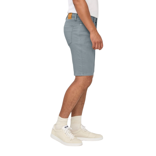 Person wearing light gray shorts on a white background