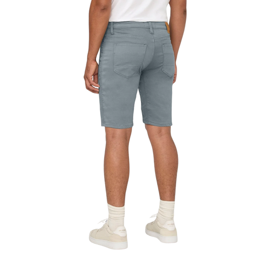 Person wearing gray shorts on a white background