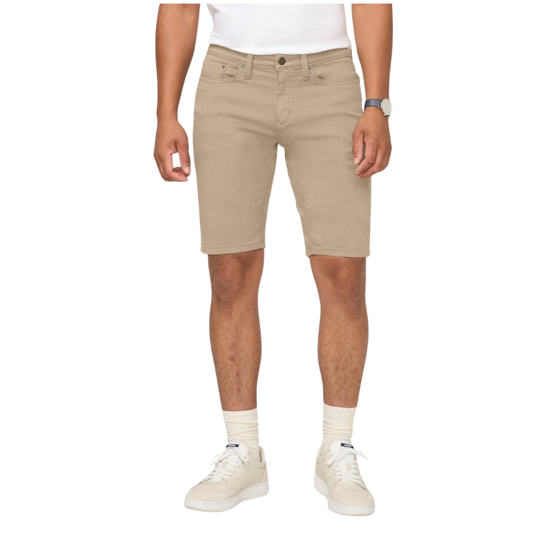 Person wearing beige shorts on a white background