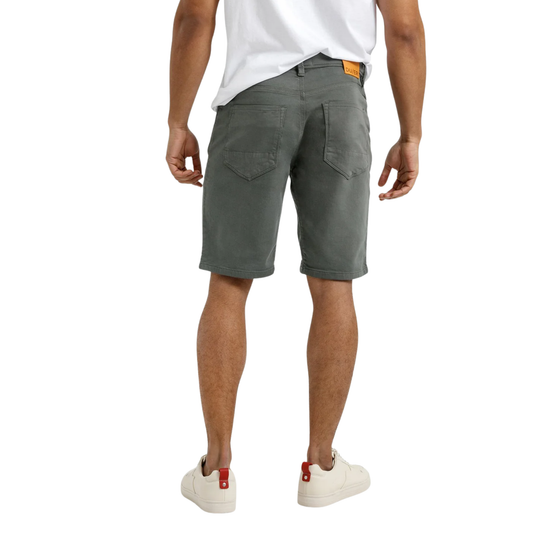 Person wearing gray shorts on a white background