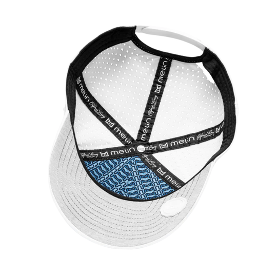 White cap with black mesh back and blue pattern on a white background