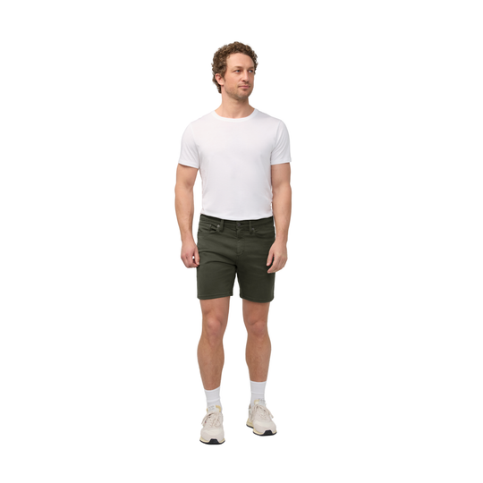 Man wearing a white t-shirt and green shorts on a white background