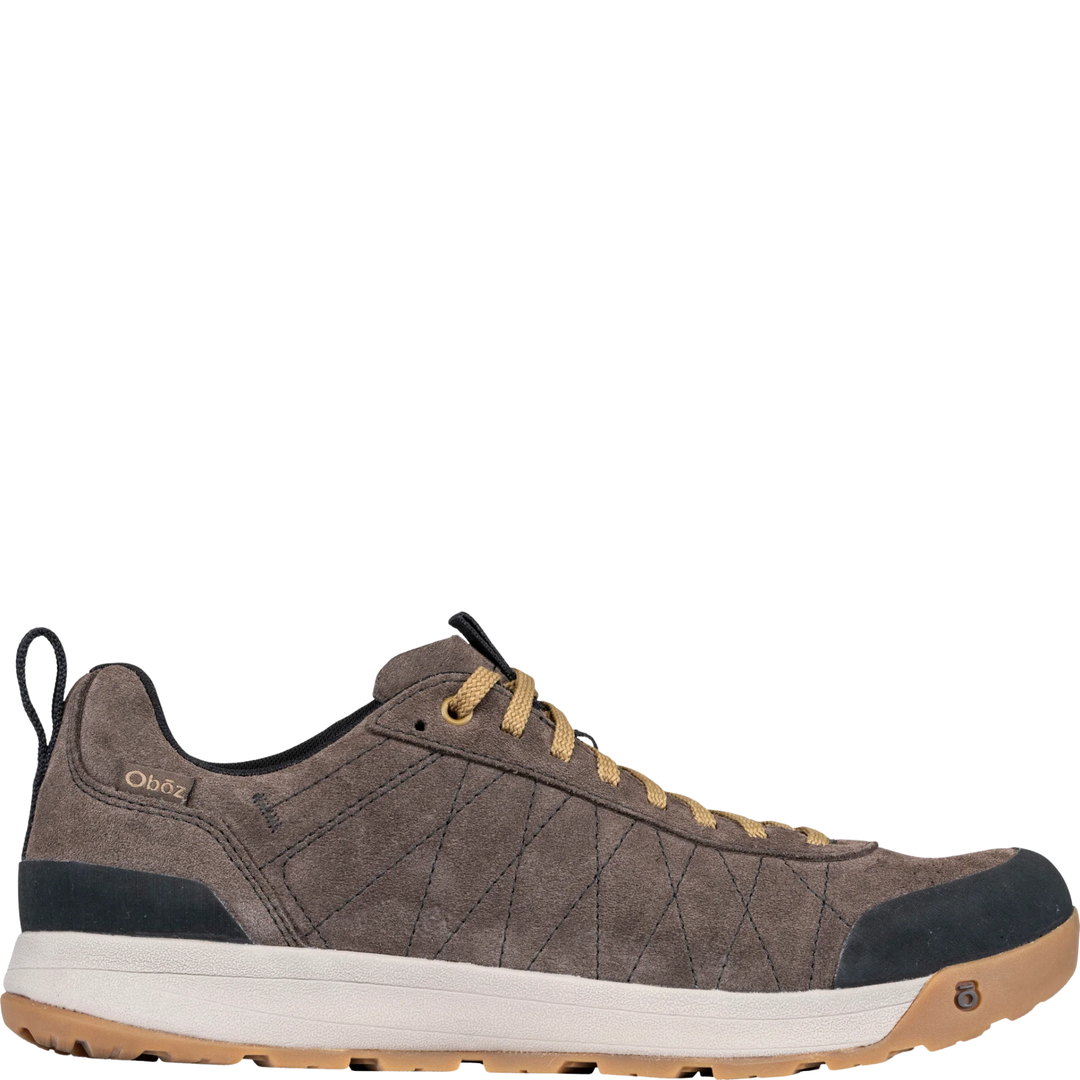 Brown sneaker with black and white sole on a white background