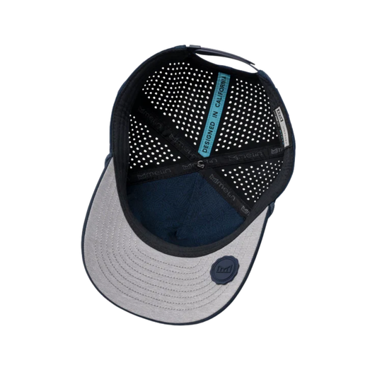 Back view of a cap with perforated design and visible brand logo on a white background