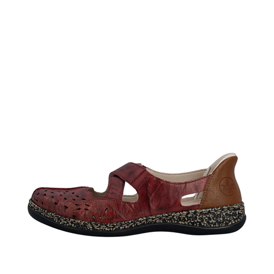Red sandal with a brown sole on a white background