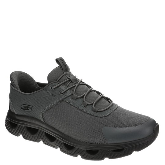 Gray sneaker with black sole on a white background