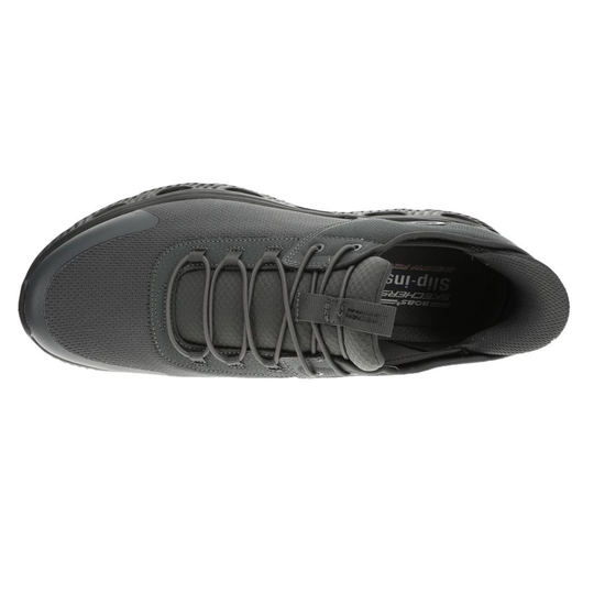 Black athletic shoe with brand logo on a white background