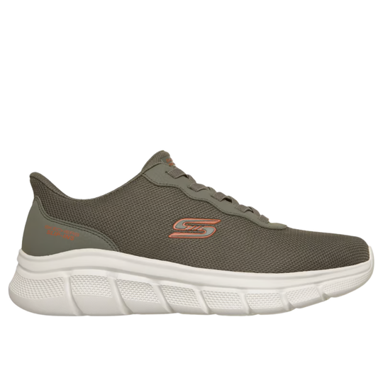 green sneaker with white sole on a white background