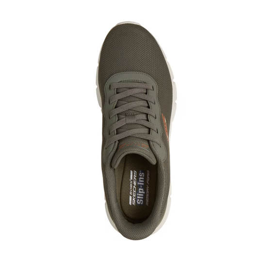 Green sneaker with white sole on a white background