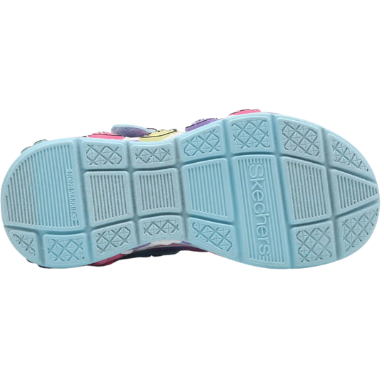 Light blue sneaker sole with Skechers branding and non-marking tread