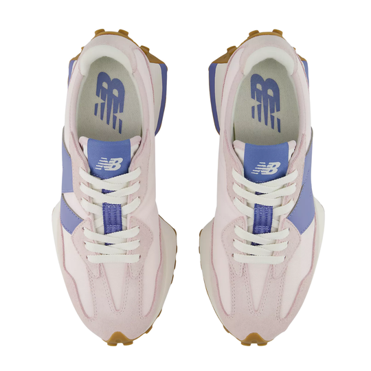 Pair of pink and blue sneakers with white laces on a white background