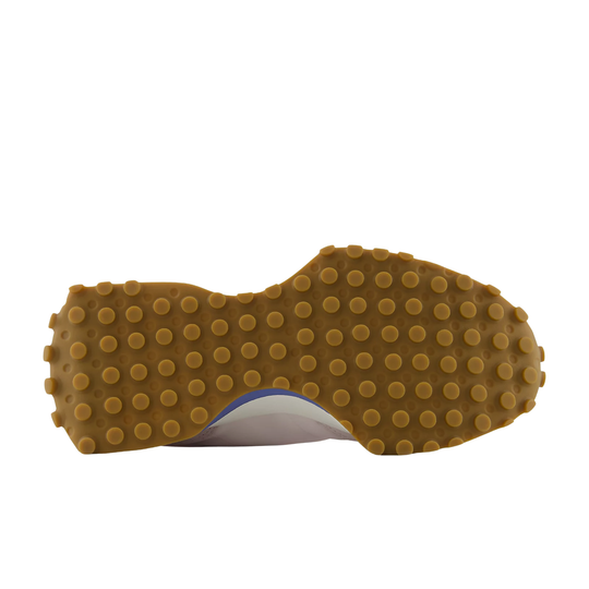 Close-up of a shoe sole with brown tread pattern on a white background