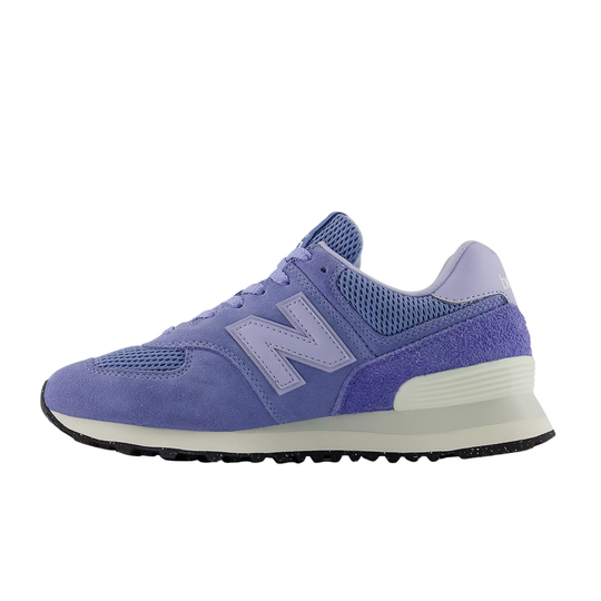 Purple-blue sneaker with mesh panels, suede overlays, and a large side logo on a white background