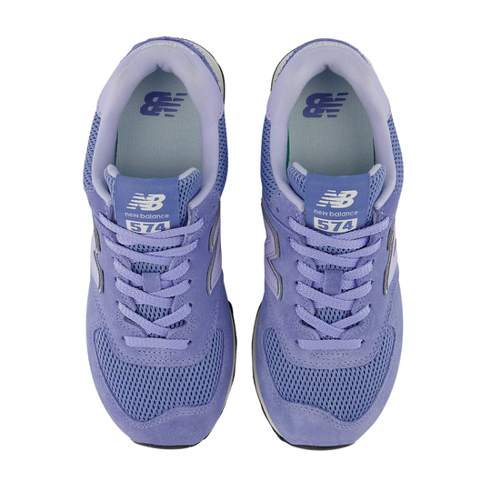 Pair of lavender sneakers with mesh uppers, laces, and 574 tongue labels on white background