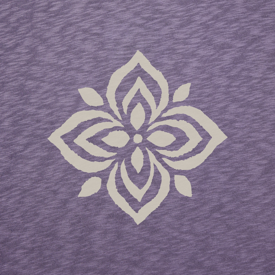 Decorative white floral pattern on a textured purple fabric background