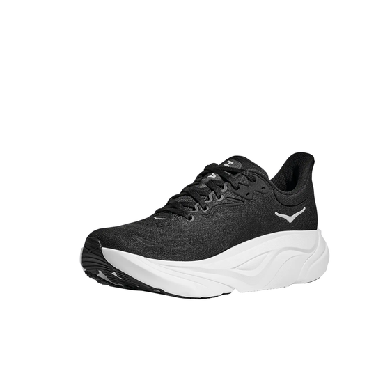 Black running shoe with white sole on a white background