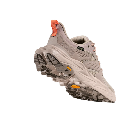 Gray hiking shoe with orange accents on a white background