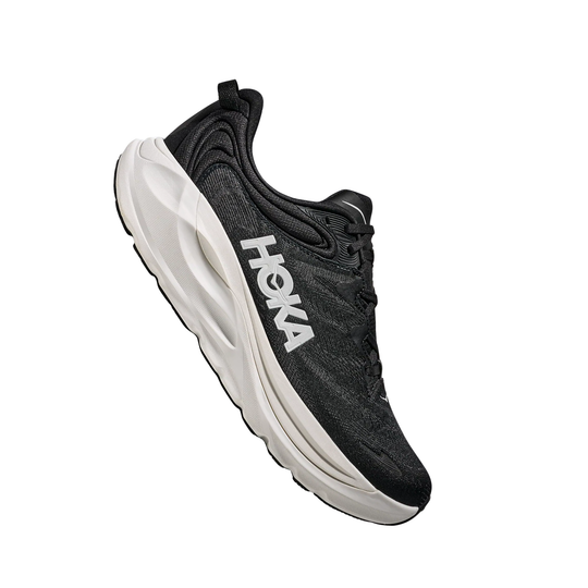 black hoka shoe with white sole